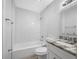 Updated bathroom with white subway tile and granite vanity at 670 16Th S Ave, St Petersburg, FL 33701