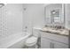 Updated bathroom with white subway tile and granite vanity at 670 16Th S Ave, St Petersburg, FL 33701