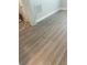 Newly installed light brown wood-look vinyl plank flooring at 670 16Th S Ave, St Petersburg, FL 33701