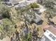 Aerial view of a home with large backyard and surrounding trees at 7103 Landmark Dr, Spring Hill, FL 34606