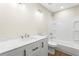 Clean bathroom featuring a white vanity and bathtub at 712 E Madison St, Plant City, FL 33563