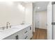 Double vanity bathroom with marble countertop and white cabinets at 712 E Madison St, Plant City, FL 33563