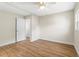 Bedroom with wood-look floors and access to bathroom at 712 E Madison St, Plant City, FL 33563