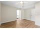 Bright bedroom with wood-look floors and ceiling fan at 712 E Madison St, Plant City, FL 33563