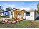 Attractive single-story home boasting a wooden porch and manicured landscaping at 712 E Madison St, Plant City, FL 33563