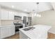 Modern kitchen with white cabinets and a large island at 712 E Madison St, Plant City, FL 33563