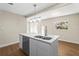 Modern kitchen island with quartz countertops and stainless steel sink at 712 E Madison St, Plant City, FL 33563