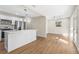 Open concept kitchen with island, stainless steel appliances and hardwood floors at 712 E Madison St, Plant City, FL 33563