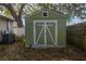 Green storage shed with white trim and double doors at 757 50Th N Ave, St Petersburg, FL 33703