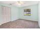 Bedroom with carpet flooring, window, and built-in closet at 819 Hilltop Dr, Brandon, FL 33511