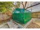 Green metal storage shed with double doors at 8620 Horizon Ln, Hudson, FL 34667