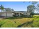 Ranch style home with two car garage and well-manicured lawn at 8970 Park Blvd # B, Seminole, FL 33777