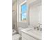 Bathroom boasts modern fixtures, including tiled shower and sleek vanity with sink at 11971 Starbright Path, Venice, FL 34293