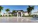 A view of the clubhouse with parking in this new construction community at 11971 Starbright Path, Venice, FL 34293