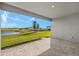Covered patio offers an enjoyable outdoor space with views of the lush green landscape at 11971 Starbright Path, Venice, FL 34293