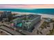 Stunning aerial view of a beachfront condo complex with turquoise waters and white sandy beaches at 12000 Gulf Blvd # 208-S, Treasure Island, FL 33706