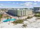 Aerial view of resort near beach and pool at 12000 Gulf Blvd # 208-S, Treasure Island, FL 33706