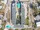 Aerial view of a condo building with pool and surrounding area at 12000 Gulf Blvd # 208-S, Treasure Island, FL 33706