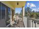 Relaxing balcony with patio furniture, offering a partial ocean view at 12000 Gulf Blvd # 208-S, Treasure Island, FL 33706