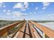 Wooden boardwalk leads to a sandy beach at 12000 Gulf Blvd # 208-S, Treasure Island, FL 33706