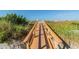 Wooden boardwalk leading to the beach at 12000 Gulf Blvd # 208-S, Treasure Island, FL 33706