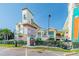 Sunset Vistas Beachfront Suites building entrance with signage and landscaping at 12000 Gulf Blvd # 208-S, Treasure Island, FL 33706