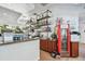 Cafe bar with liquor shelves and Coca-Cola fridge at 12000 Gulf Blvd # 208-S, Treasure Island, FL 33706