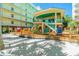 Elevated community building with a deck and colorful chairs at 12000 Gulf Blvd # 208-S, Treasure Island, FL 33706