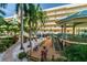 Relaxing patio area with colorful chairs and landscaping at 12000 Gulf Blvd # 208-S, Treasure Island, FL 33706