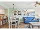 Bright dining area with a table and chairs, open to living room at 12000 Gulf Blvd # 208-S, Treasure Island, FL 33706
