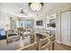 Bright dining area with table and chairs, open to living room and kitchen at 12000 Gulf Blvd # 208-S, Treasure Island, FL 33706