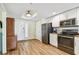 Kitchen with stainless steel appliances and view of entryway at 12000 Gulf Blvd # 208-S, Treasure Island, FL 33706