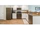 Modern kitchen with stainless steel appliances and granite countertops at 12000 Gulf Blvd # 208-S, Treasure Island, FL 33706