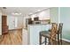 Kitchen with granite countertop and breakfast bar with two stools at 12000 Gulf Blvd # 208-S, Treasure Island, FL 33706