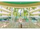 Outdoor patio furniture with tropical view at 12000 Gulf Blvd # 208-S, Treasure Island, FL 33706