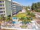 Heated pool with surrounding patio furniture at 12000 Gulf Blvd # 208-S, Treasure Island, FL 33706