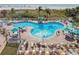 An inviting resort-style pool with plenty of lounge chairs and umbrellas at 12000 Gulf Blvd # 208-S, Treasure Island, FL 33706