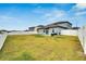 Spacious backyard with grassy area and privacy fence at 12783 Maple Bonsai Dr, Riverview, FL 33579