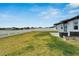 Spacious backyard with grassy area and privacy fence at 12783 Maple Bonsai Dr, Riverview, FL 33579
