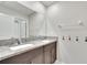 Double vanity bathroom with granite countertop at 12783 Maple Bonsai Dr, Riverview, FL 33579