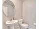 Small bathroom with pedestal sink and toilet at 12783 Maple Bonsai Dr, Riverview, FL 33579