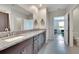 Double vanity bathroom with granite countertops at 12783 Maple Bonsai Dr, Riverview, FL 33579