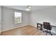Simple bedroom with a desk and large window at 12783 Maple Bonsai Dr, Riverview, FL 33579