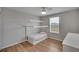 Well-lit bedroom with a house-shaped bed and wood floor at 12783 Maple Bonsai Dr, Riverview, FL 33579