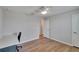 Bedroom with a built-in desk and ceiling fan at 12783 Maple Bonsai Dr, Riverview, FL 33579