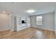 Bright bonus room with built-in shelving and hardwood floors at 12783 Maple Bonsai Dr, Riverview, FL 33579