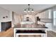 Dining area with farmhouse table, bench, and view into the kitchen at 12783 Maple Bonsai Dr, Riverview, FL 33579