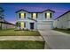Two-story house with attached garage and landscaping at 12783 Maple Bonsai Dr, Riverview, FL 33579