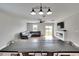 Living room with sectional sofa, fireplace, and sliding doors to backyard at 12783 Maple Bonsai Dr, Riverview, FL 33579