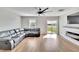 Spacious living room featuring a fireplace and sliding glass doors to backyard at 12783 Maple Bonsai Dr, Riverview, FL 33579